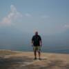 Huk standing between two volcanos at Lake Atitlan in Guatemala.