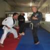 Huk kicking Marty Z for his promotion to 7th Degree Black.