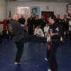 Huk kicks Joe Doyle for 6th Degree Black Belt, January 2005.